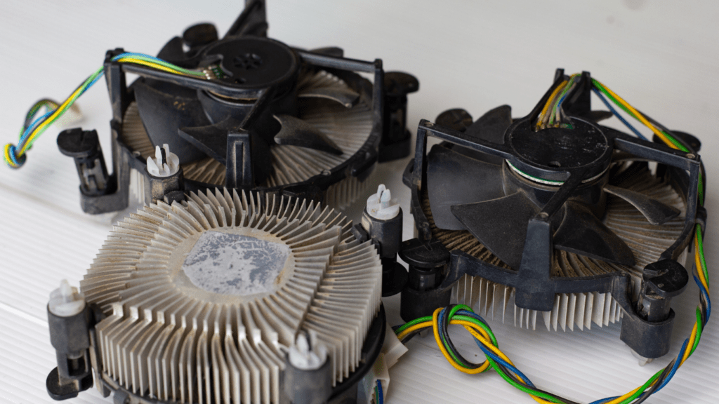 three cpu coolers are sitting on top of each other