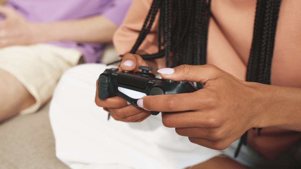 a person holding a gaming controller