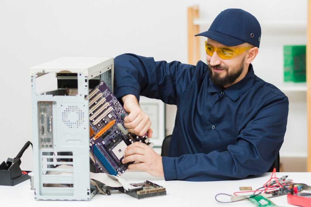 a person repairing a computer