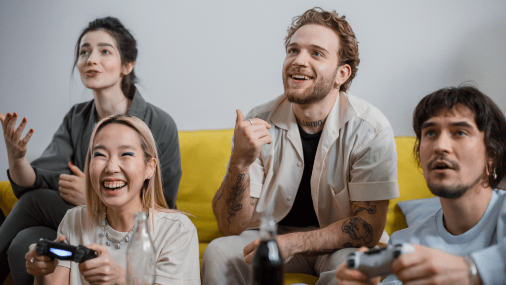 a person sitting on the couch playing gaming console