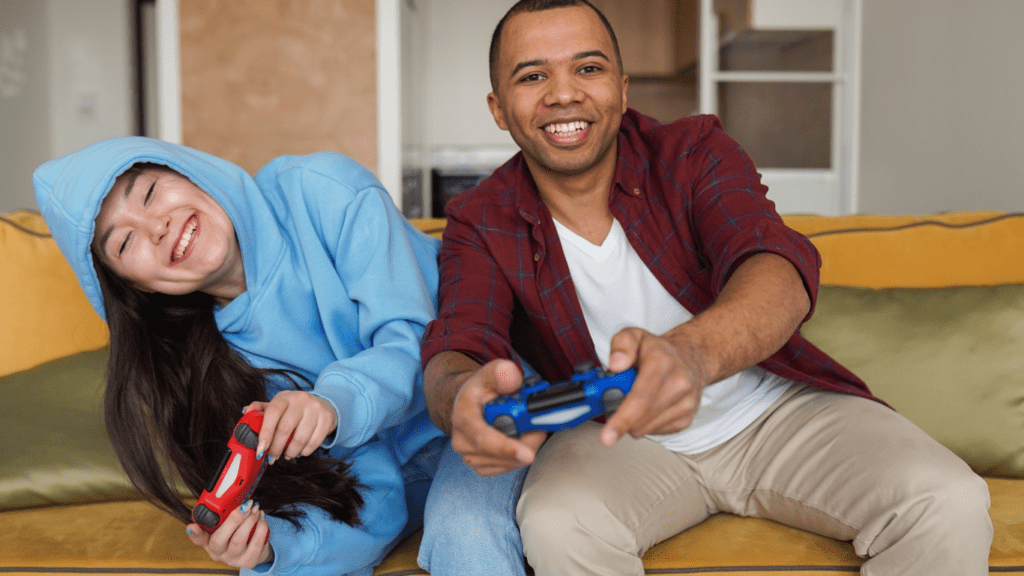 a person sitting on the couch playing video games