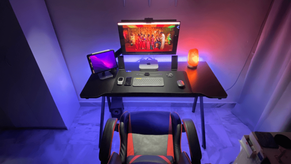 an orange and black gaming chair in a dark room